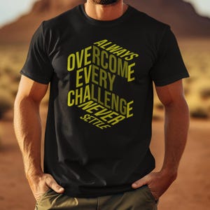 May include: Black t-shirt with the text "ALWAYS OVERCOME EVERY CHALLENGE NEVER SETTLE" in yellow, arranged in a geometric design. The shirt is short-sleeved and appears to be made of a soft material.