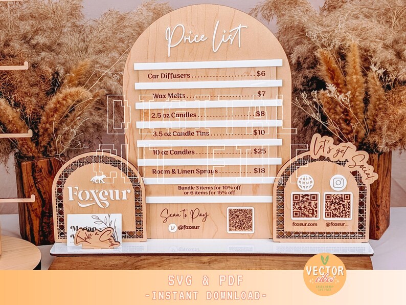 May include: A wooden price list sign with a white background and brown text. The sign lists prices for car diffusers, wax melts, candles, and room and linen sprays. The sign also includes a QR code and the text "Let's get Social".