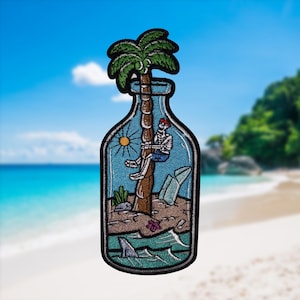 May include: An embroidered patch depicting a glass bottle containing a palm tree, a skeleton sitting on a branch, and a shark swimming in the water. The bottle is filled with sand, a seashell, and a piece of paper.