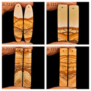 May include: Four pairs of polished stone pendants featuring natural landscape patterns in shades of tan, cream, and brown. Each piece includes a small drilled hole at the top. The sets are labeled JI-7210, JI-7211, JI-7212, and JI-7213.