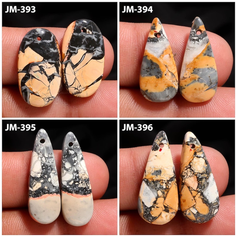 May include: Four pairs of gemstone pendants in various shapes and colors. The pendants feature a mix of black, tan, gray, and white hues. Each pendant has a hole at the top for stringing. The pendants are displayed against a neutral background.