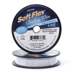 May include: White spool of Soft Flex Beading Wire, labelled "Fine", with a test strength of 10 lbs, a diameter of 0.014 inches, and a length of 100 feet. The spool is made in the USA and is for use with seed beads and freshwater pearls.
