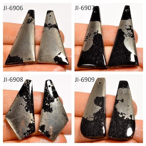 May include: Four pairs of pyrite gemstone pendants in various shapes: triangular, trapezoidal, and diamond. Each pendant has a dark, metallic base with a lighter, speckled pattern. The pendants are labeled with the codes JI-6906, JI-6907, JI-6908, and JI-6909.