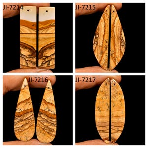 May include: Four pairs of polished landscape jasper pendants featuring natural tan, brown, and cream banded patterns. Each piece has a small drilled hole at the top for suspension. The shapes include rectangular, marquise, and teardrop silhouettes.