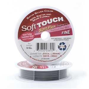 May include: A spool of silver Soft Flex Company Soft Touch Premium Flex Wire. The spool is labeled with the product name, test strength (10 lbs), diameter (0.014 in), length (100 ft), and number of strands (21).