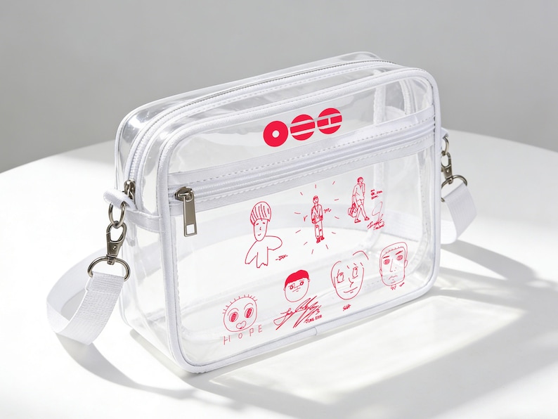 May include: Transparent crossbody bag with a white strap and zip. The bag has red illustrations of faces and figures, and the word "HOPE". The bag is rectangular and made of clear plastic.