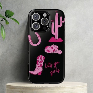 May include: Black phone case with a pink cactus, horseshoe, cowboy hat, and boot with the text "Let's go girls".