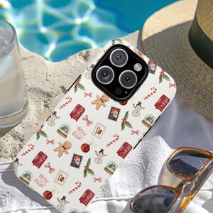 Festive Christmas Phonecase for iPhone 14 and Samsung S24 with ornaments, bows, and seasonal gift graphics