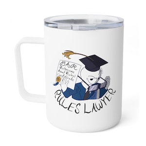 May include: White travel mug with a humorous illustration of a stick figure in a graduation cap, holding a certificate labeled "BAR (Bothersome About Rules) Certificate." The mug also features the words "RULES LAWYER."