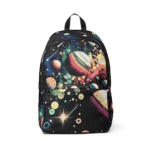 May include: Black backpack featuring a vibrant space-themed design. The pattern showcases planets, stars, and meteorites in blue, orange, yellow, and green. The backpack has a top handle and a front pocket.