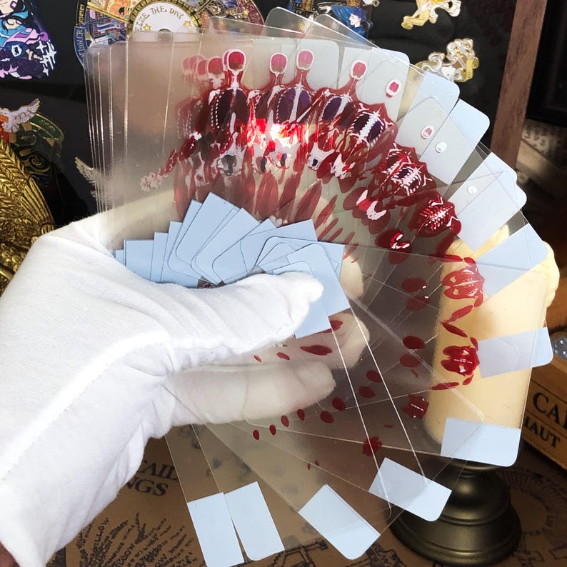 Transparent Skeleton Slice Playing Cards shown mid-flourish in a dynamic hand display, capturing the light through the clear cards while the red UV skeleton ink glows subtly, tailored for advanced cardists, street performers, and those searching for artistic cardistry props and poker accessories.