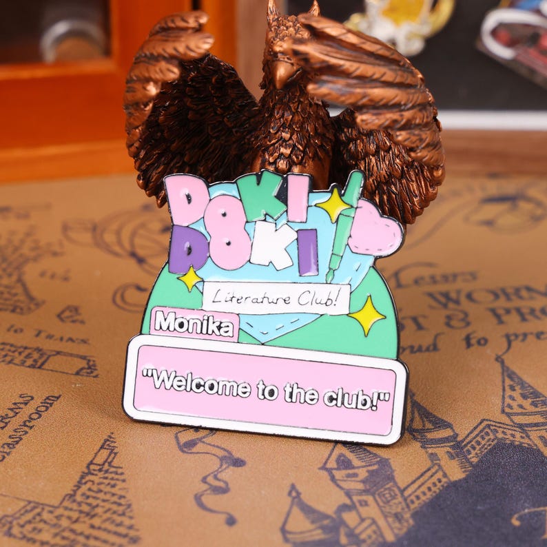 DDLC anime enamel pin set displayed on a decorative board, showcasing the glossy enamel finish and detailed character design. These pins are inspired by the popular visual novel Doki Doki Literature Club and are perfect for fans of galgames, anime aesthetics, and kawaii accessories. Whether used for Halloween cosplay, Christmas holiday gifts, or everyday ita bag fashion, these character pins offer great collectible value for Etsy buyers and anime collectors.