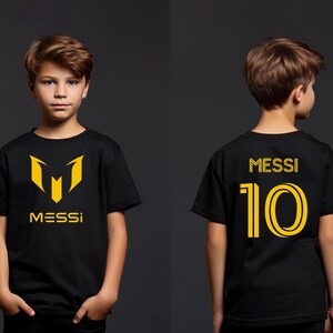 a young boy wearing a messi shirt