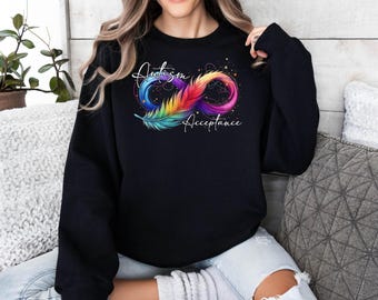 May include: Black sweatshirt with a rainbow infinity symbol and the words "Autism Acceptance" in white text.