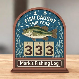 May include: Wooden fishing log with a blue background featuring a fish illustration and the text "FISH CAUGHT THIS YEAR." The log displays the number "333" and the name "Mark's Fishing Log."