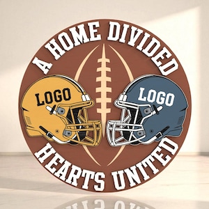 May include: A circular wooden sign with the text "A HOME DIVIDED HEARTS UNITED" in white. The sign features a football shape and two football helmets, one gold and one blue, each with the word "LOGO".