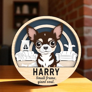 May include: A circular wooden sign with a cartoon Chihuahua illustration. The dog has brown and white fur and large eyes, set against a blue backdrop. The sign reads "HARRY" and "Small frame, giant soul."