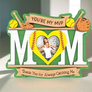 May include: A wooden photo frame with a green and white baseball theme. The frame has a heart-shaped cutout for a photo and the words "You're My MVP" and "Thank You for Always Catching Me".
