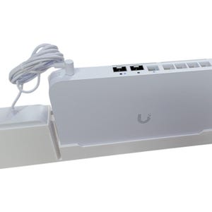 May include: A white electronic device with a power adapter and a coiled white cable. The device has multiple ports and a small logo. The power adapter is rectangular. The device is designed to sit on a white base.