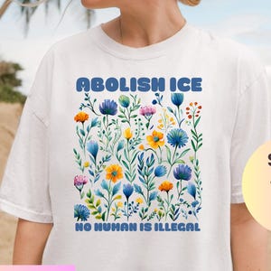Comfort Colors® Floral Abolish ICE Human is Illegal Shirt, Political Resistance Shirt, Anti-Trump Activist Wear, No Human is Illegal T-Shirt