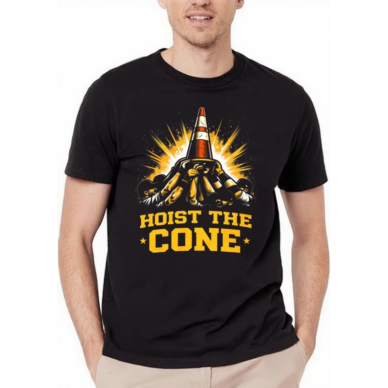 May include: Black t-shirt featuring a graphic of a traffic cone being lifted by multiple hands, with a yellow light burst. The text "HOIST THE CONE" is in yellow, with stars on either side.