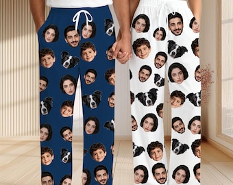 May include: Two pairs of pajama pants, one navy blue and one white, each covered in a repeating pattern of faces and dog portraits. The pants have a drawstring waist and a relaxed fit, perfect for lounging.