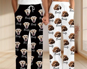 May include: Black and white pajama pants with a repeating pattern of a dog's face and the name "Brady" in a script font. The other pair of pajama pants are white with a repeating pattern of a brown dog's face and the name "Brady".