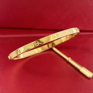 Vintage bracelet 18k yellow gold size 16 width 3.65 mm with screwdriver