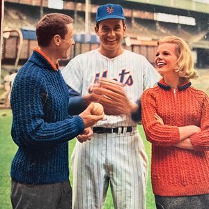 May include: A vintage magazine cover featuring three people, a man in a baseball uniform, a woman in a red sweater, and a man in a blue sweater. The magazine is called "Spinnerin" and the cover text reads "Fun Time Fashions".