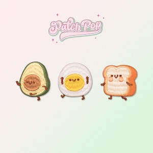 May include: Three embroidered patches featuring a smiling avocado, egg, and slice of bread. Each patch has a cartoon-like face and small legs. The patches are on a light pink background with the text "Patch Pop" in a retro font.