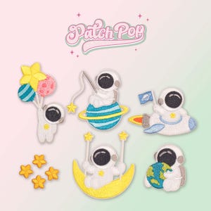 May include: Set of seven embroidered iron-on patches featuring cute astronaut characters in various space-themed scenes. The patches include an astronaut holding balloons, an astronaut fishing on a planet, an astronaut flying in a rocket, an astronaut riding a crescent moon, an astronaut holding a globe, and two small star patches.