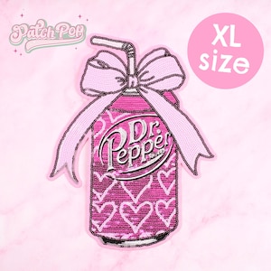 May include: A pink sequined patch in the shape of a Dr. Pepper can with a bow and straw. The can features the Dr. Pepper logo and white heart patterns. The patch is labeled "XL size" and has the "Patch Pop" logo.