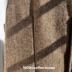 May include: Close-up of a brown herringbone fabric with a coffee brown hue. The fabric has a textured appearance with a repeating V-shaped pattern. The text "1920s coffee brown" is visible at the bottom of the image.