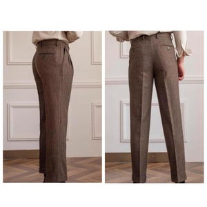 May include: Brown herringbone trousers with a tailored fit. The high-waisted trousers have pleats and a straight leg. The fabric has a subtle texture, and the trousers are cuffed at the hem. Suitable for formal or business wear. The trousers are approximately 100 cm in length.