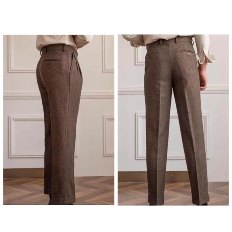 May include: Brown herringbone trousers with a tailored fit. The high-waisted trousers have pleats and a straight leg. The fabric has a subtle texture, and the trousers are cuffed at the hem. Suitable for formal or business wear. The trousers are approximately 100 cm in length.