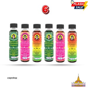 May include: Six bottles of Mae Kularb brand oil with black caps and colorful labels. The labels feature a portrait of a woman and text in multiple languages. A "Flash Sale" banner is in the top right.