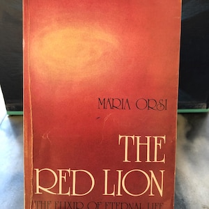 May include: A vintage book titled "The Red Lion" by Maria Orsi. The cover is a gradient of red and orange with white lettering. The subtitle reads "The Elixir of Eternal Life."