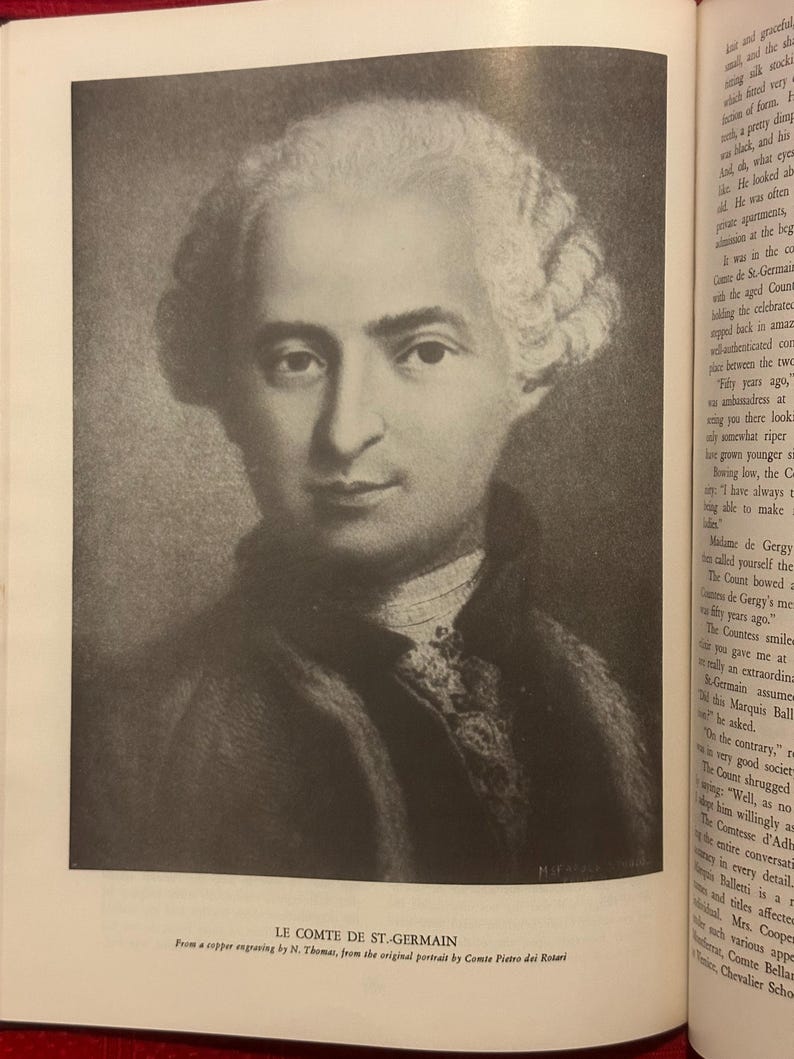 May include: A monochrome portrait of Le Comte de St. Germain, from a copper engraving by N. Thomas. The image depicts a man with a powdered wig and a serious expression. The text below reads: From a copper engraving.