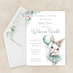 May include: Baby shower invitation with a bunny illustration holding a balloon. The invitation includes the text "Some bunny is on the way" and details for Rebecca Smith's baby shower, including the date, time, and location in Darwin, NT.
