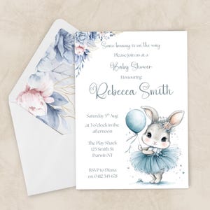 May include: Baby shower invitation with a watercolour illustration of a bunny holding a balloon. The invitation includes the text "Some bunny is on the way" and event details, including the honoree's name, date, time, and location.