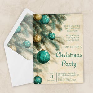 May include: A Christmas party invitation with a white envelope. The invitation features teal and gold ornaments hanging from a pine branch. Text on the invitation reads "Tis the season for food, drinks and good cheer!" and "Christmas Party."