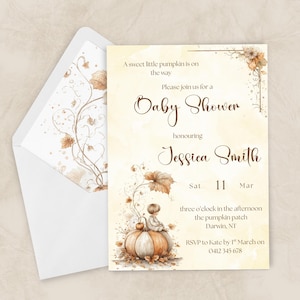 May include: Baby shower invitation with a watercolour design. The invitation features a pumpkin illustration with a baby sitting on top. The text reads "Baby Shower" honouring Jessica Smith. The envelope has a matching floral design.