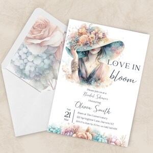May include: A bridal shower invitation with a watercolor illustration of a woman in a hat, surrounded by flowers. The invitation reads "Love in Bloom" and includes event details. The envelope features a floral design.