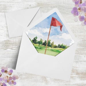 May include: A watercolor painting of a golf course with a red flag on a pole in the center of the green. The sky is blue with white clouds. The trees are green and the grass is green.