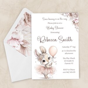 May include: Baby shower invitation with a watercolour illustration of a bunny holding a balloon, wearing a tutu and floral crown. The invitation includes the text "Some bunny is on the way" and details for Rebecca Smith's baby shower.
