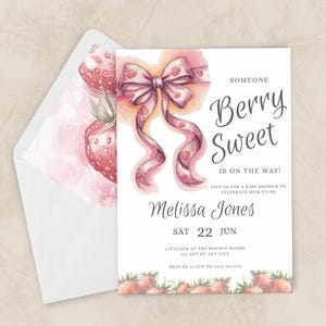 May include: A baby shower invitation with a watercolour design. The invitation features a pink bow with strawberry accents and the words "Berry Sweet." The envelope has a strawberry design. The invitation includes the name Melissa Jones and the date.