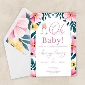 May include: A baby shower invitation with a floral design. The invitation features pink and yellow flowers, green leaves, and the words "Oh Baby!" in pink script. The envelope has a floral pattern.