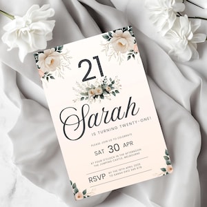 May include: A white and gold floral design birthday invitation for a 21st birthday party. The invitation features the text "21 Sarah is turning twenty-one!" with the date "Sat 30 Apr" and the time "Four o'clock in the afternoon". The invitation also includes the location "The Jumping Castle, Melbourne" and RSVP information.