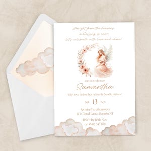 May include: A baby shower invitation with a watercolor angel illustration. The invitation features the name "Samantha" and event details. The design includes floral accents and cloud motifs, with a matching envelope.