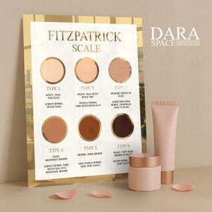 May include: A skincare product display featuring a Fitzpatrick Scale chart with skin tone examples. The chart is accompanied by a pink jar, a tube, and a smaller tube. The Dara Space logo is visible in the upper right corner.